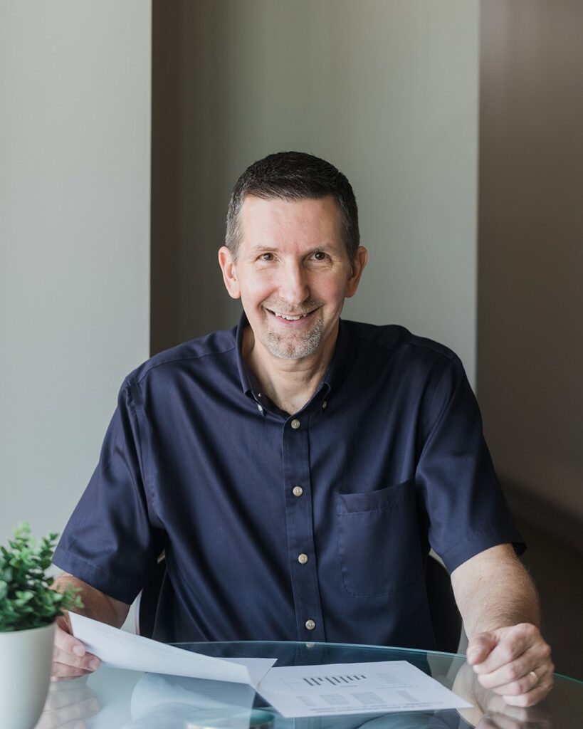 Mike Panfil, bookkeeper, reviewing financial documents